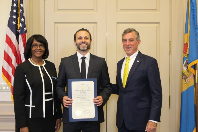Argentek CEO Andy Molanes receiving the 2023 Exporter of the Year award from Delaware Governor John Carney at a Small Business Administration ceremony Argentek CEO Andy Molanes receiving the 2023 Exporter of the Year award from Delaware Governor John Carney at a Small Business Administration ceremony